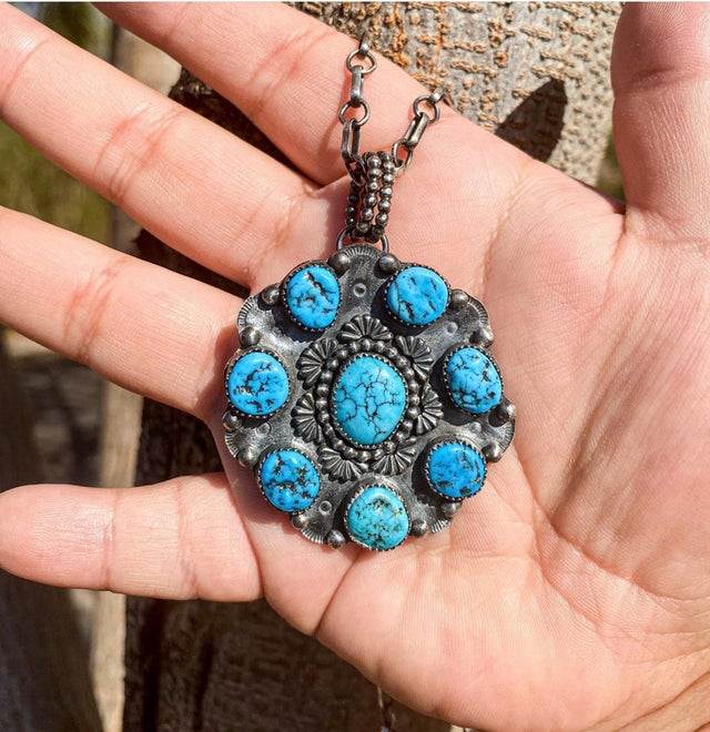 turquoise pendant made with accent setting sun castings